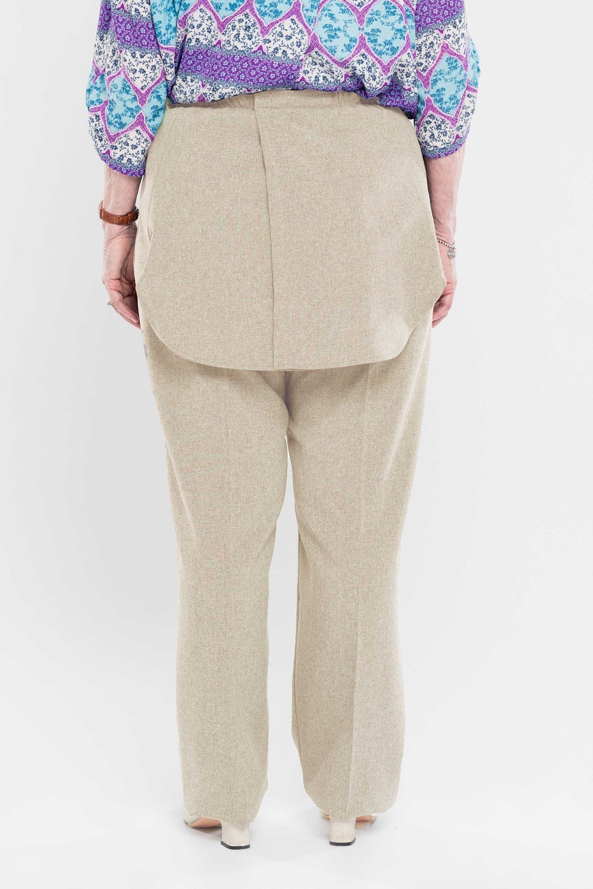 Stay comfortable and discreet with our adaptive pants. Designed with a back opening and double panels to conceal incontinence undergarments, these pants offer an attractive heathered tone and are our best seller. Easy metal snaps make dressing a breeze. P