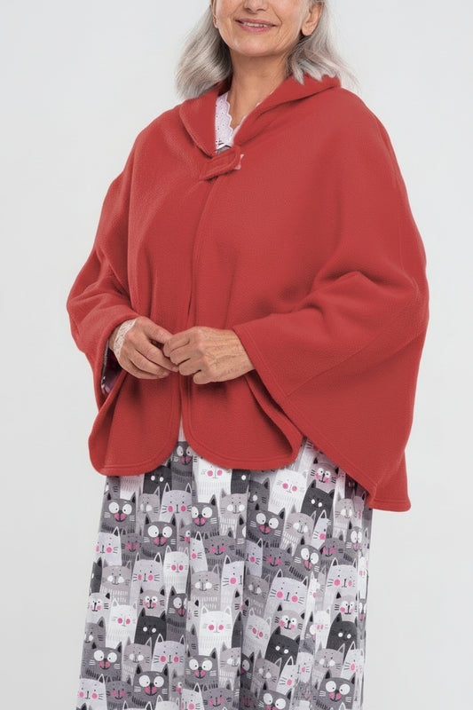 Stay warm and cozy with our Cape in Polar Fleece. This versatile bedcoat doubles as a cape, perfect for added warmth and style. Made with soft polar fleece, it's not only comfortable but also comforting. Available in pastel or classic colors for a touch o
