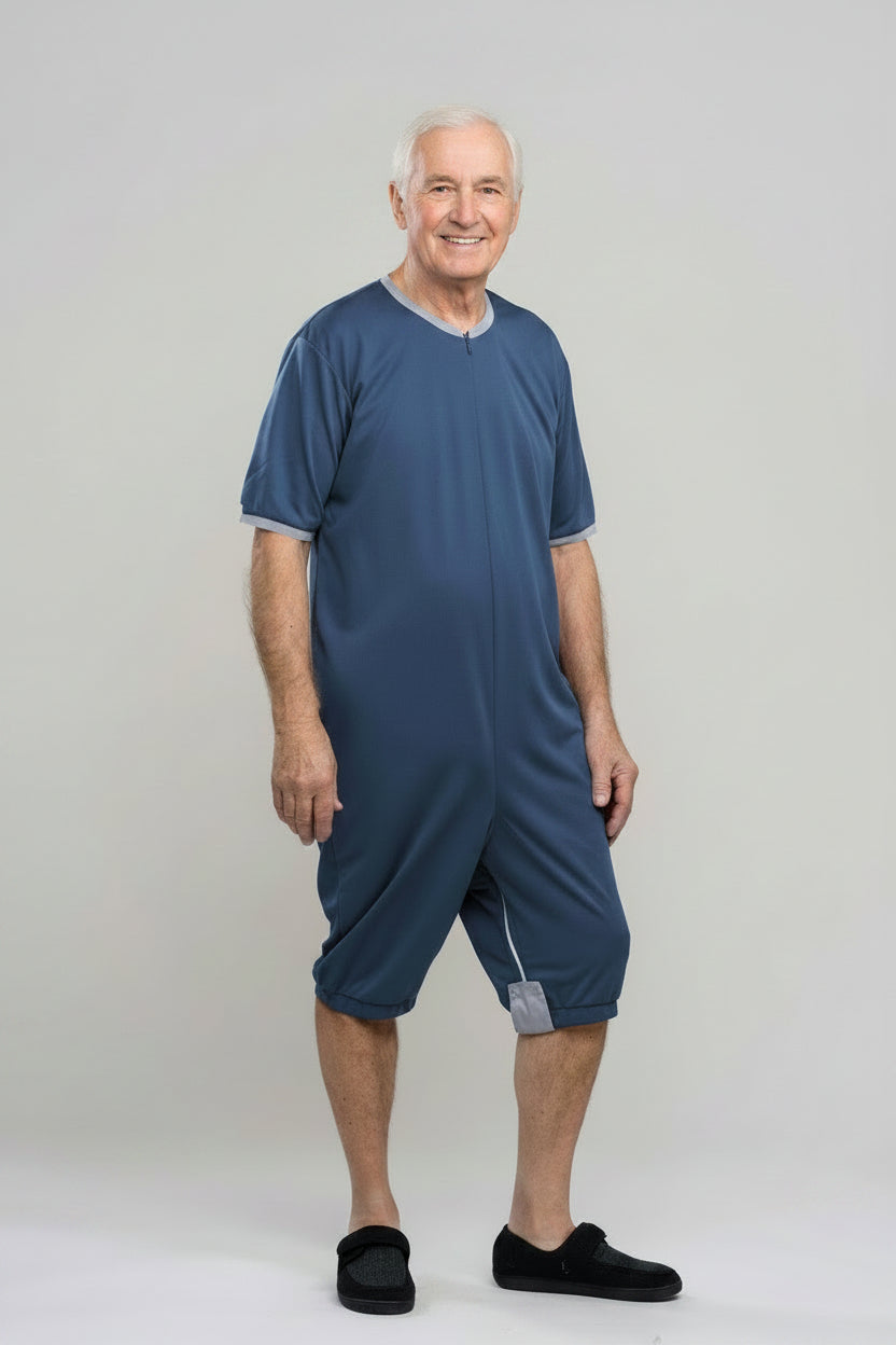 Adaptive short legs onesie designed for people suffering from dementia. A zipper on the back of the garment prevents the wearer from undressing.  A large, zippered crotch opening facilitates diaper changes.  Durable soft mesh knit dries quickly. Can be wo