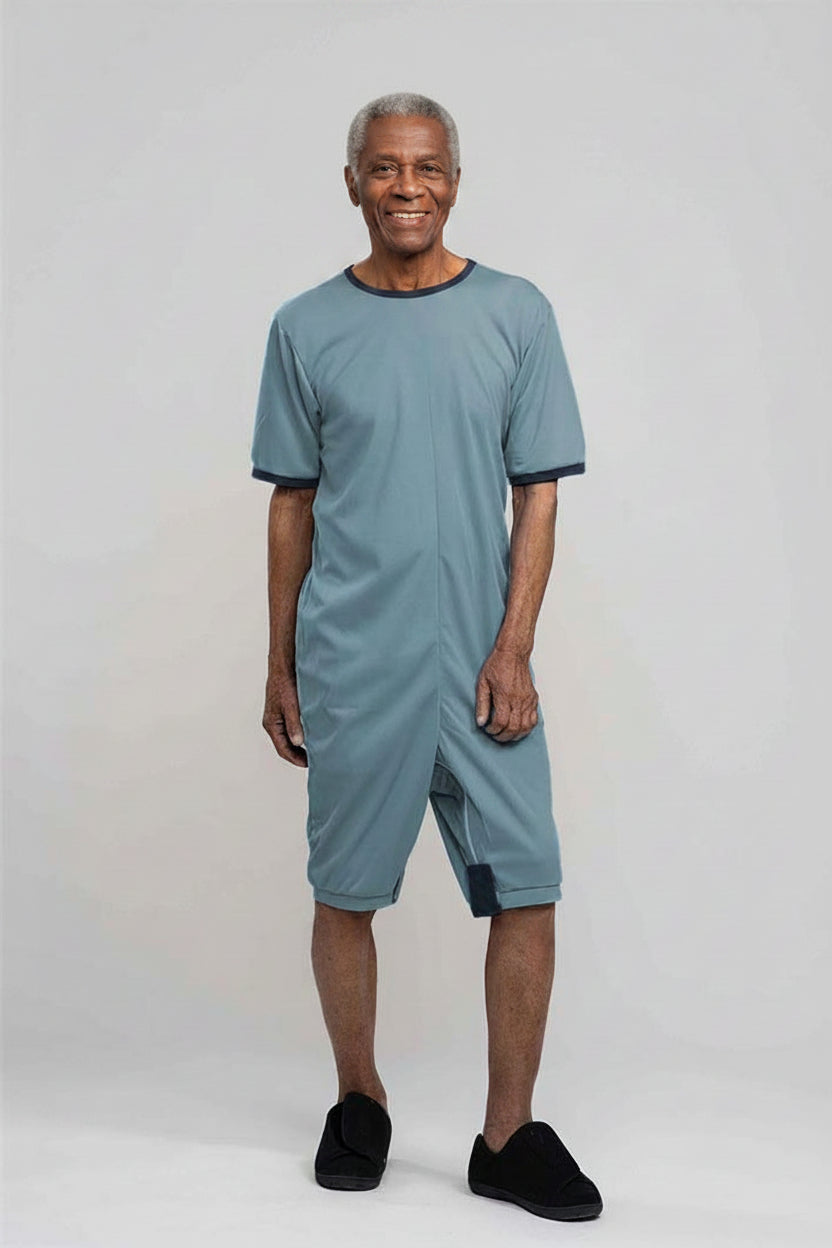 Adaptive short legs onesie designed for people suffering from dementia. A zipper on the back of the garment prevents the wearer from undressing.  A large, zippered crotch opening facilitates diaper changes.  Durable soft mesh knit dries quickly. Can be wo