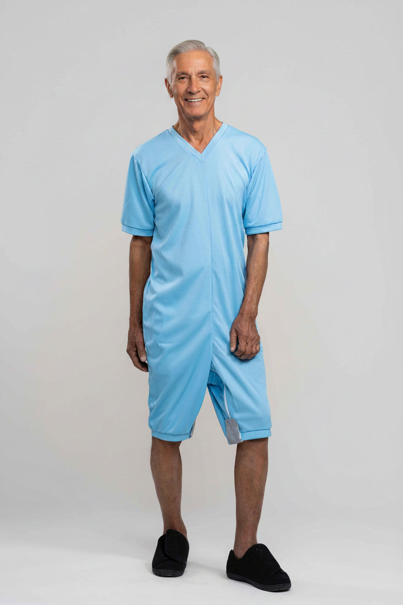 Adaptive short legs onesie designed for people suffering from dementia. A zipper on the back of the garment prevents the wearer from undressing.  A large, zippered crotch opening facilitates diaper changes.  Durable soft mesh knit dries quickly. Can be wo