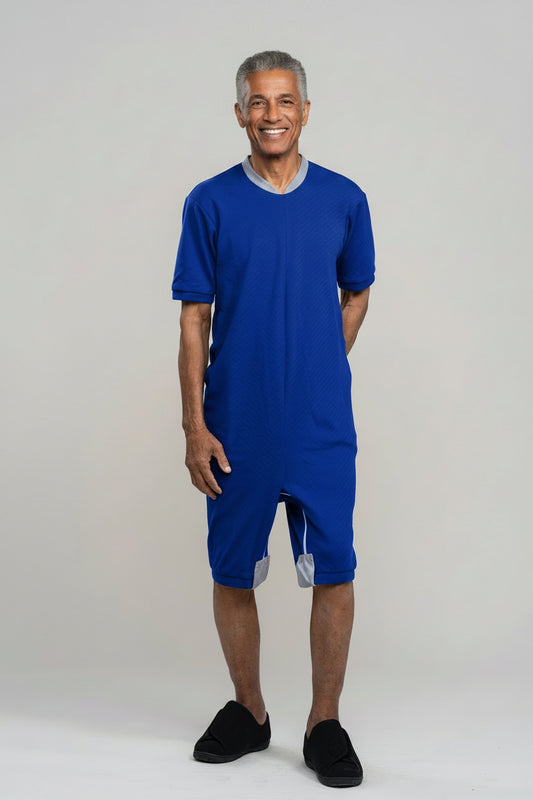 Adaptive short legs onesie designed for people suffering from dementia. A zipper on the back of the garment prevents the wearer from undressing.  A large, zippered crotch opening facilitates diaper changes.  Durable soft mesh knit dries quickly. Can be wo