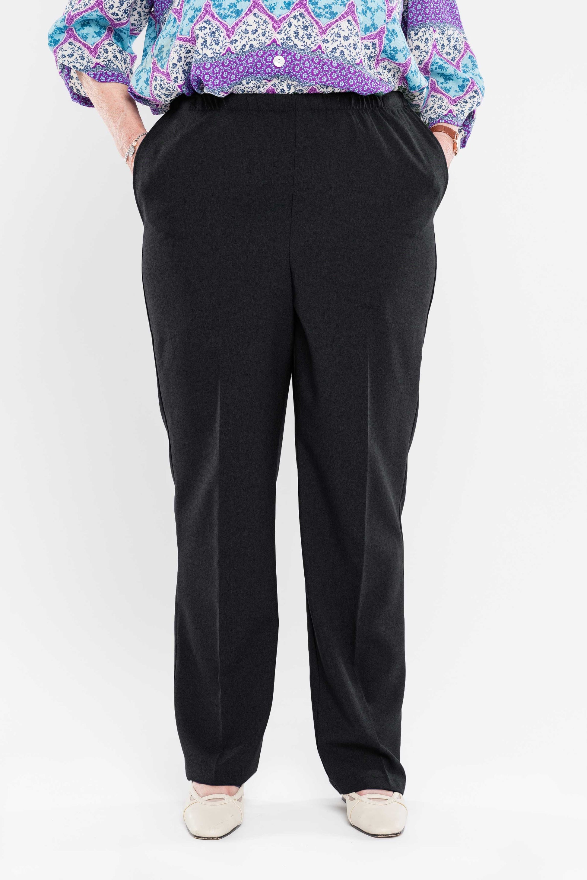 Enjoy effortless dressing with our adaptive pants featuring side openings and snap closures. Made with gabardine fabric, these women's pants are both stylish and easy to care for with their machine-washable polyester material. Simplify your day-to-day rou
