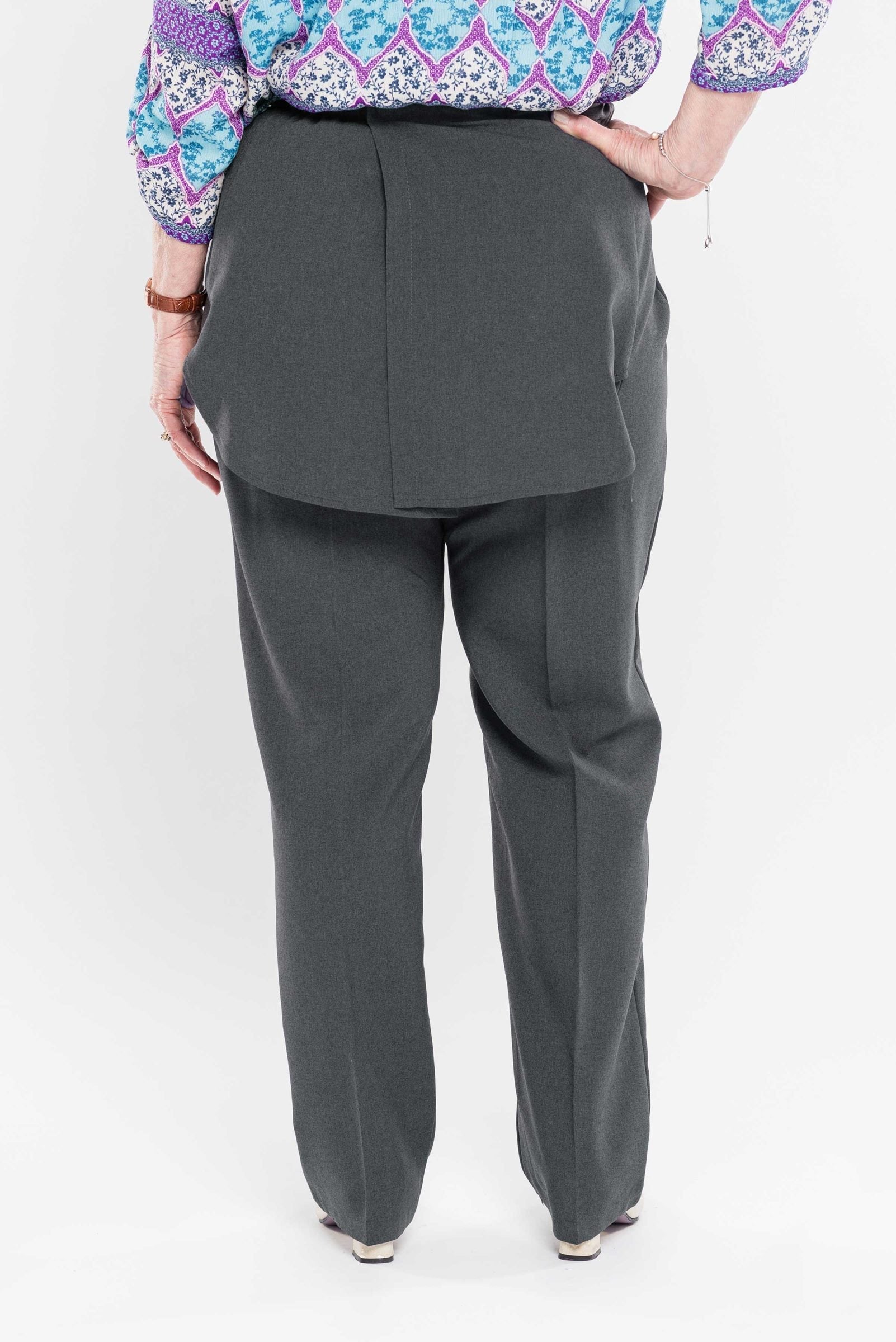 Stay comfortable and discreet with our adaptive pants. Designed with a back opening and double panels to conceal incontinence undergarments, these pants offer an attractive heathered tone and are our best seller. Easy metal snaps make dressing a breeze. P