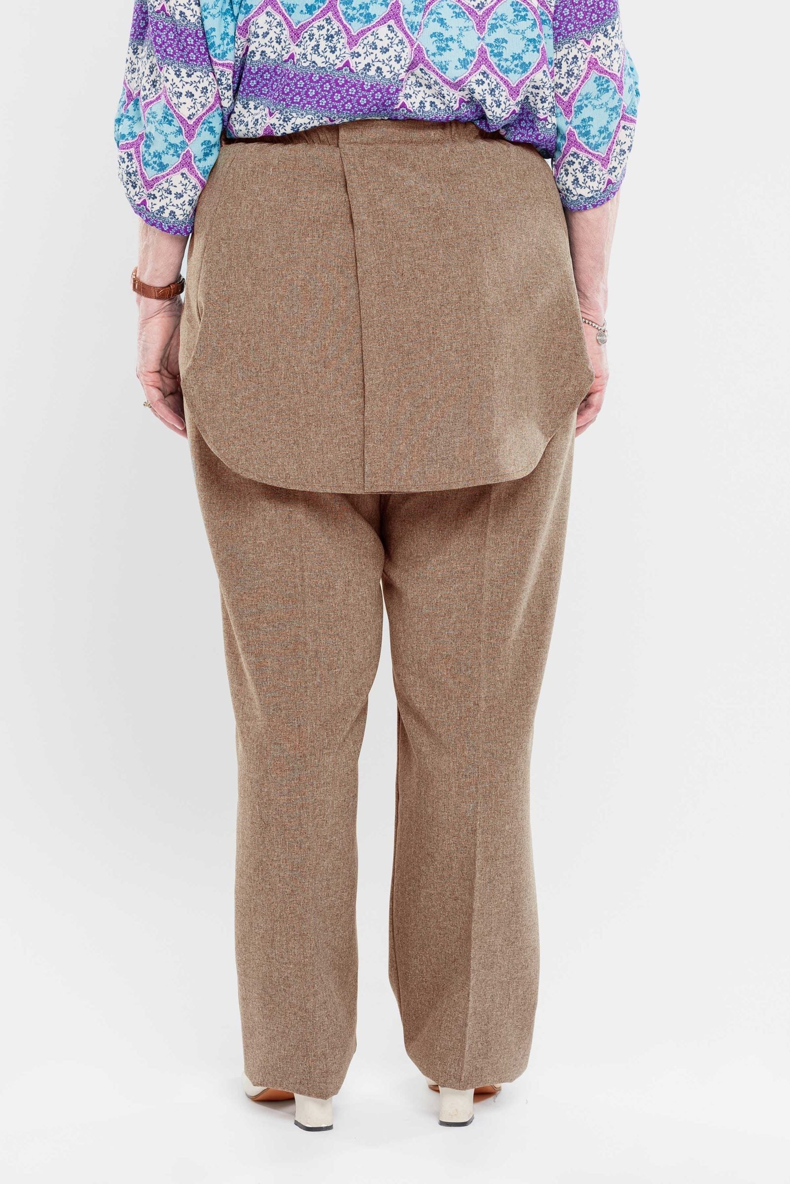 Stay comfortable and discreet with our adaptive pants. Designed with a back opening and double panels to conceal incontinence undergarments, these pants offer an attractive heathered tone and are our best seller. Easy metal snaps make dressing a breeze. P