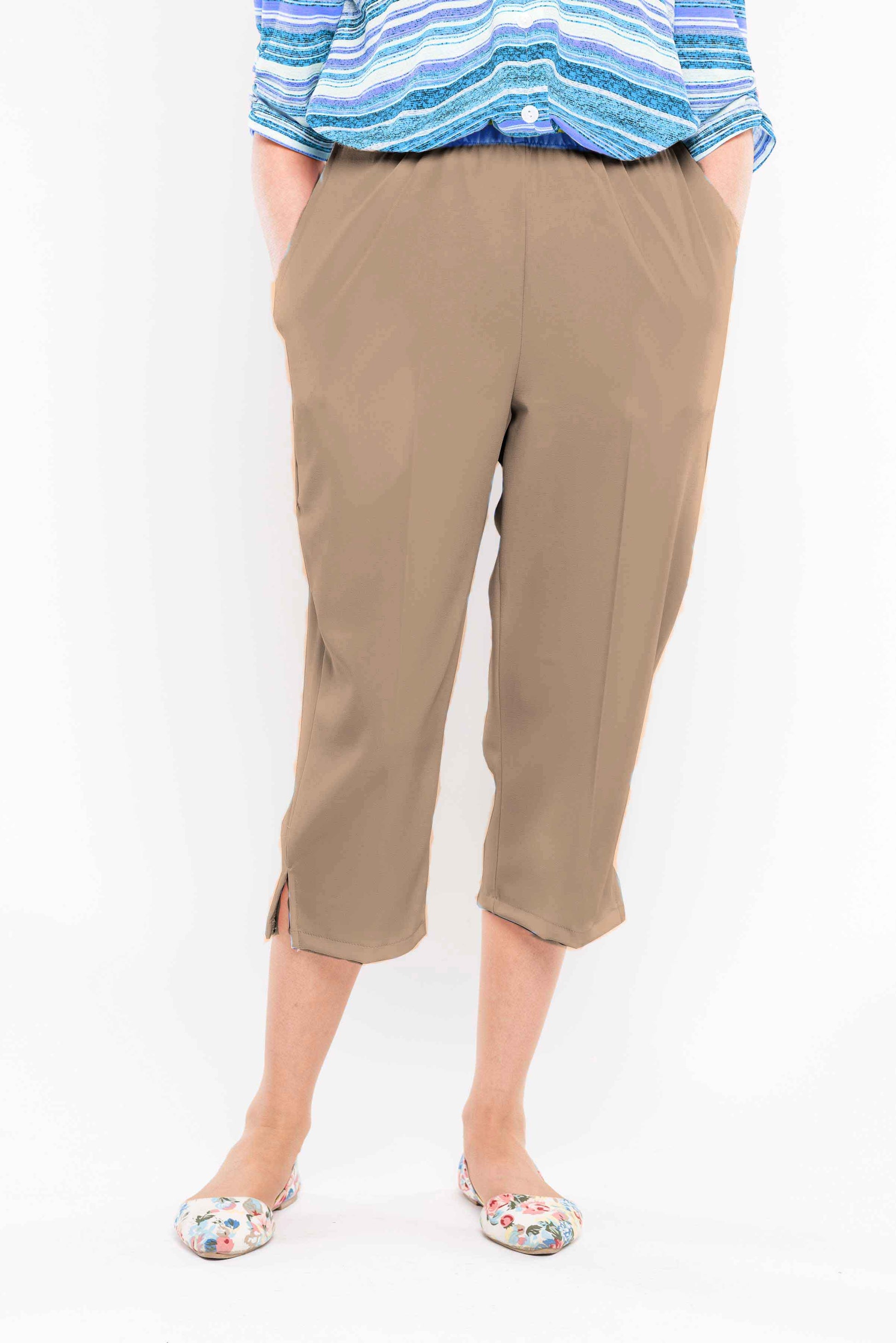 Stay comfortable and stylish this summer with our adaptive capri featuring large side openings with metal snaps. Made with machine-washable polyester, it's perfect for everyday wear. Upgrade your wardrobe with this versatile and easy-to-maintain capri.