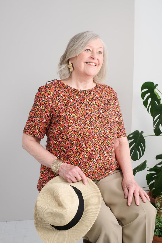 Stay comfortable and stylish with our 1ZT386-2B100 Adaptive Basic Top. The brushed knit fabric and short sleeves provide a soft and breathable feel, while the beautiful flower pattern in coral and pink adds a touch of charm to your wardrobe. Look and feel