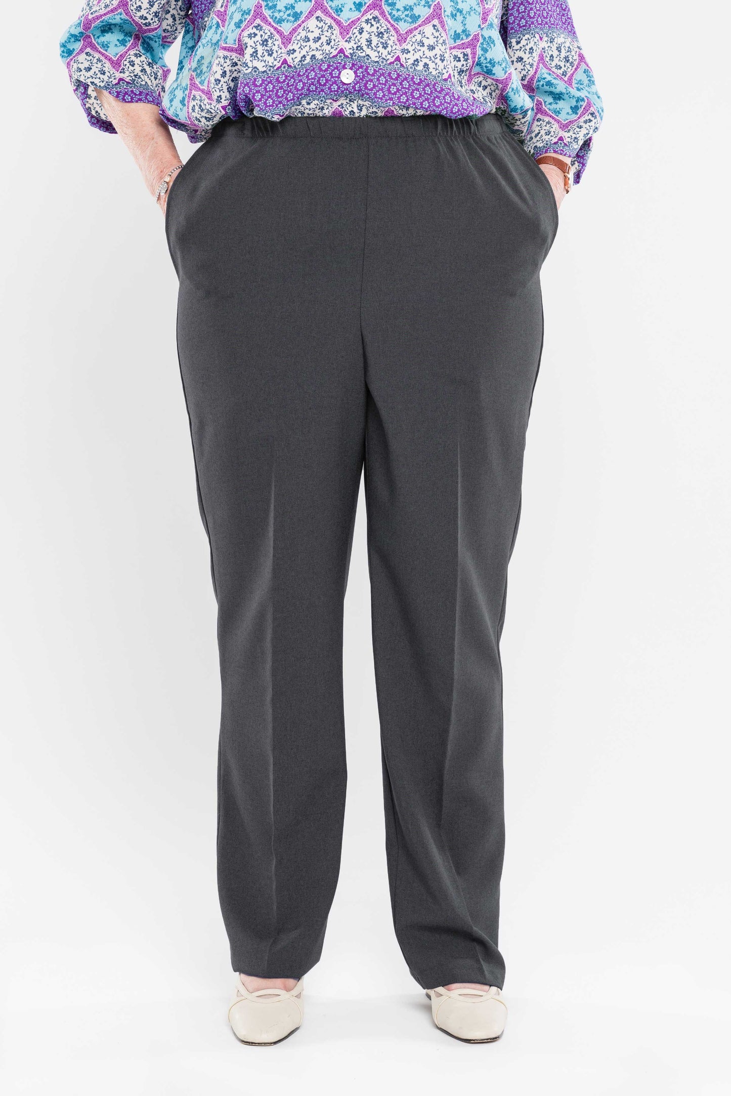 Stay comfortable and stylish with our adaptive pants. Designed for women, our pants feature convenient side openings with snap closures. Made from machine-washable gabardine polyester, these pants also have an attractive heathered tone. Perfect for everyd