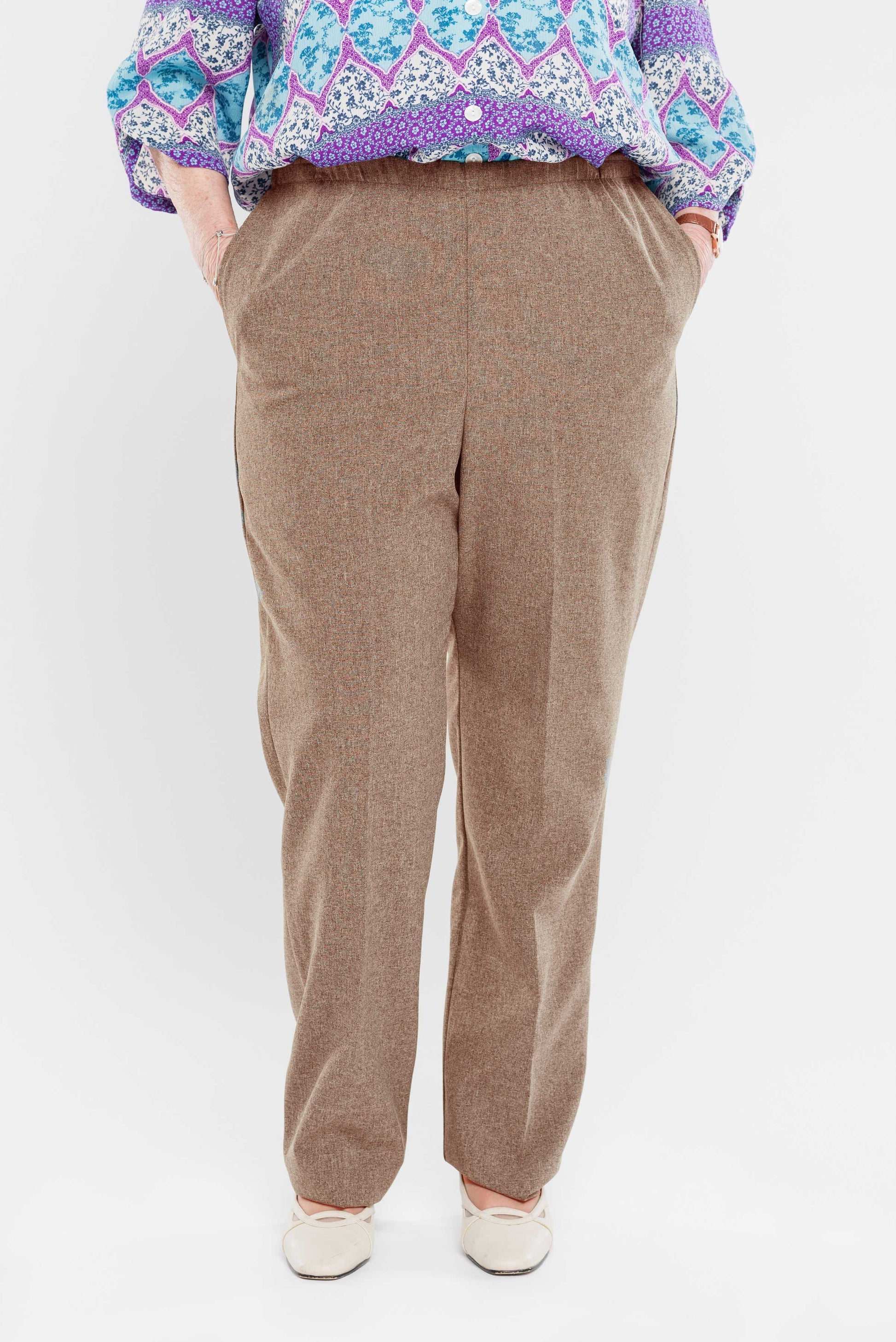 Stay comfortable and stylish with our adaptive pants. Designed for women, our pants feature convenient side openings with snap closures. Made from machine-washable gabardine polyester, these pants also have an attractive heathered tone. Perfect for everyd