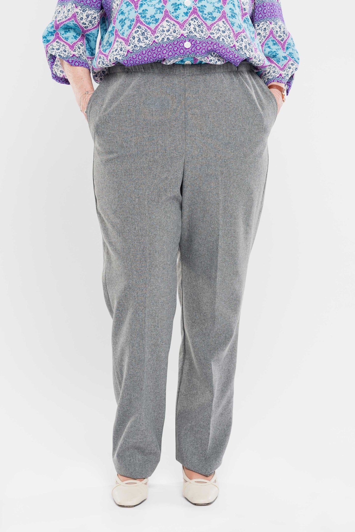 Stay comfortable and stylish with our adaptive pants. Designed for women, our pants feature convenient side openings with snap closures. Made from machine-washable gabardine polyester, these pants also have an attractive heathered tone. Perfect for everyd