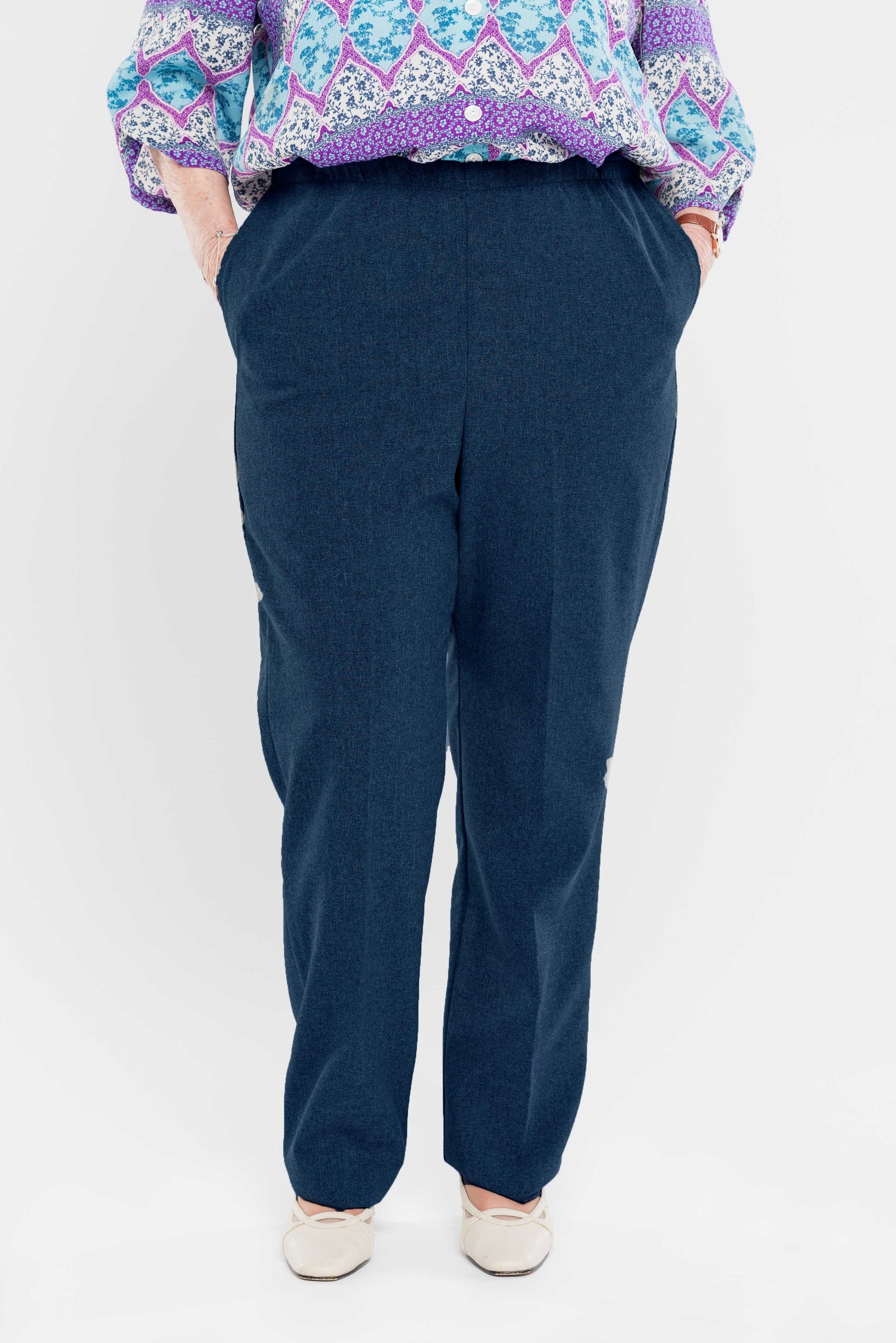 Stay comfortable and stylish with our adaptive pants. Designed for women, our pants feature convenient side openings with snap closures. Made from machine-washable gabardine polyester, these pants also have an attractive heathered tone. Perfect for everyd